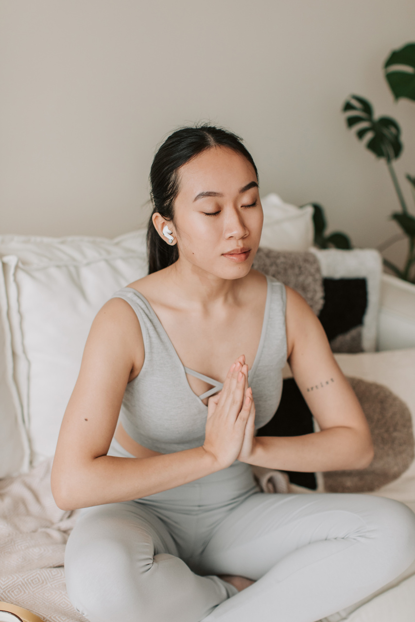 Woman Meditating at Home